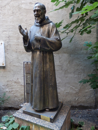 8 bronze statue of ? on Mulberry Street