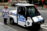 20 Ange next to an NYPD vehicle on Centre Street